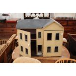 AN EARLY TO MID 20TH CENTURY PAINTED PINE DOLL'S HOUSE 77cm wide