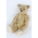 A 1920'S STEIFF BLOND TEDDY BEAR, button to ear, 48cm in length