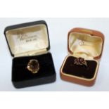 A 9 CARAT GOLD AND SMOKEY QUARTZ SET LADIES RING together with a 9 carat gold and possibly garnet