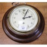 A CIRCULAR OAK CASED WALL CLOCK, silvered dial with Arabic numerals, subsidiary second hand, 18cm