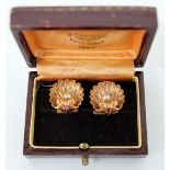 A PAIR OF 18 CARAT GOLD CULTURED PEARL RUBY EAR CLIPS of scalloped shell form, each stamped 750,