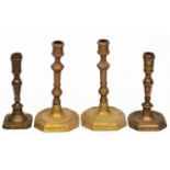 TWO 17TH CENTURY BRASS CANDLESTICK, each 17cm in height and two similar candlesticks (4)