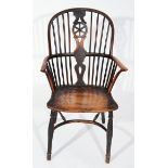 AN ANTIQUE YEW AND ELM COUNTRY MADE WHEEL BACK WINDSOR ARMCHAIR, with a crinoline stretcher and