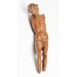 AN ANTIQUE CARVED BOXWOOD SCULPTURE OF CHRIST CRUCIFIED, 17cm high (losses)