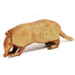 AN ANTIQUE TAXIDERMIC NINE-BANDED ARMADILLO, 30cm in length