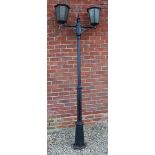 A BLACK PAINTED ALUMINIUM TWO LIGHT STREET LANTERN with turned column support and a hexagonal