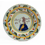 AN 18TH CENTURY DUTCH TIN GLAZED DELFTWARE POLYCHROME PLATE decorated with a profile portrait of