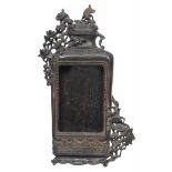 A 19TH CENTURY ORIENTAL CARVED HARDWOOD PICTURE FRAME in the form of an urn adorned with flowers,