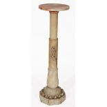 A VICTORIAN CARVED ALABASTER MOORISH STYLE PEDESTAL OR TORCHERE with circular top and column support