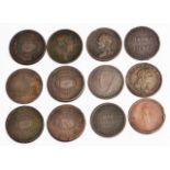 A GROUP OF TWELVE EARLY 19TH CENTURY COPPER PENNY TOKENS, to include four 1813 Newcastle tokens; one