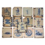 A GROUP OF 13 ANTIQUE BLUE AND WHITE DELFT TILES decorated with figures and animals, all