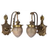 A PAIR OF GEORGIAN STYLE BRASS WALL LIGHT BRACKETS of classical form with flaming finial, the scroll