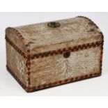 AN ANTIQUE PONY SKIN DOME TOPPED CASKET with a studded leather boarder and lined with marbled paper,