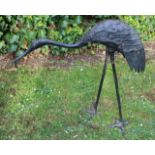 A CAST BRONZED SCULPTURE OF A STANDING CRANE, 61cm high