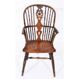 AN ANTIQUE ASH AND ELM WHEELBACK SPINDLE ARMCHAIR, with turned supports, 55cm wide