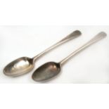 A PAIR OF GEORGE III SILVER TABLE SPOONS with feather edge decoration, marks for 'London, 1775'