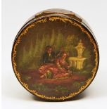 A 19TH CENTURY CONTINENTAL CIRCULAR LACQUER BOX, the lid decorated with a scene of two lovers within