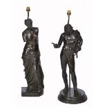 A MATCHED PAIR OF ANTIQUE BRONZE TABLE LAMPS, one in the form of Venus, the other an athlete, each