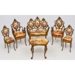 AN EARLY 20TH CENTURY AUSTRIAN GILT METAL HAND PAINTED PORCELAIN MINIATURE SUITE OF FURNITURE  to