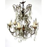 A GILT METAL SIX LIGHT ELECTROLIER, with swags of glass drops hanging from the scrolling arms,