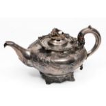 A VICTORIAN SILVER TEAPOT of squat ovoid form, the lid with cast floral knop and with 'C' scroll