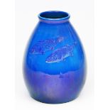 AN OVOID BLUE LUSTRE VASE decorated with two fish, marked beneath 'St Lucas, Utrecht', 26cm high