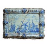 A LATE 18TH/EARLY 19TH CENTURY DUTCH DELFTWARE MOULDED RECTANGULAR PLAQUE depicting a town scene