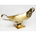 AN EARLY 20TH CENTURY SILVER GILT TWIN HANDLED COMPORT by Albert Edward Jones with all over hammered