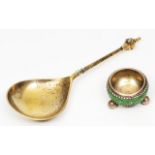 A CONTINENTAL SILVER GILT 17TH CENTURY STYLE SPOON with a fig shaped bowl and mask finial,