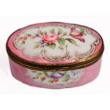 A GEORGE III OVAL PINK GROUND ENAMEL BOX decorated with floral sprays within scrolling white