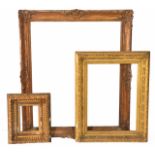 A GROUP OF THREE VARIOUS ANTIQUE GILT GESSO MOULDED PICTURE FRAMES, the largest has an aperture of