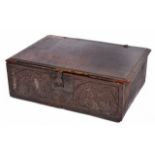 A 17TH OR 18TH CENTURY OAK BIBLE BOX with zigzag decoration to the lid and thistle carved front,