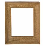 A 19TH CENTURY GILT PICTURE FRAME, concave and with moulded classical motifs, the aperture 41.5cm