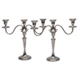 A PAIR OF MID 20TH CENTURY SILVER THREE LIGHT CANDELABRA, each with twin scrolling reeded arms and