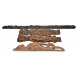 FOUR ANTIQUE CARVED WOODEN ELEMENTS to include a vine of fruits, two religious figures and