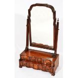 A 19TH CENTURY BURR WALNUT VANEERED DRESSING TABLE MIRROR, the swinging mirror above shaped front