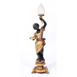 A 19TH CENTURY ITALIAN CARVED PAINTED AND PARCEL GILT BLACKAMORE TORCHERE FIGURE holding a glass