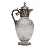 A VICTORIAN SILVER MOUNTED CUT GLASS CLARET JUG the body with fruiting acanthus leaf scroll,