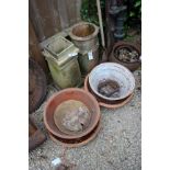 TWO OLD CHIMNEY POTS, one square, one cylindrical together with two terracotta dairy pans and two