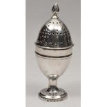 A GEORGIAN IRISH SILVER PEPPERETTE of ovoid form with fitted flame knob finial and pierced upper