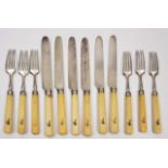 AN EARLY 19TH CENTURY SILVER AND IVORY HANDLED SET OF DESSERT KNIVES AND FORKS, the handles with