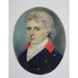 A 19TH CENTURY OVAL PORTRAIT MINIATURE ON IVORY of a gentleman with grey hair carrying a blue coat