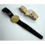 AN ACCURIST 21 JEWEL ANTI-MAGNETIC 9 CARET GOLD CASE WATCH with silvered dial, 3cm diameter together