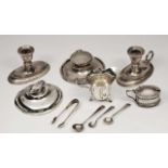 A SMALL QUANTITY OF VARIOUS SILVER ITEMS to include a pair of squat silver chamber sticks, a