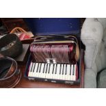 A VINTAGE HOHNER ACCORDION in a fitted case