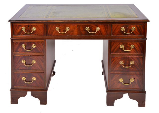A MAHOGANY PEDESTAL DESK with leather inset top and brass swan neck handles 122cm wide