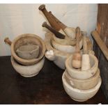 A SELECTION OF PESTLE AND MORTARS, the largest 41cm wide together with a quantity of J Schweppe & Co