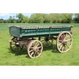 AN OLD GREEN AND PINK PAINTED BOX WAGON possibly North Oxfordshire, with spindle decoration, painted