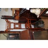 A CHINESE HARDWOOD HALL STAND with pierced decoration to the raised back and a central support for