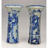 A NEAR PAIR OF ANTIQUE CHINESE BLUE AND WHITE OCTAGONAL FLARED VASES, each 22cm in height